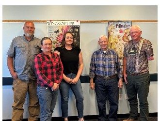 Five members of the Gem SWCD board standing together in the district office