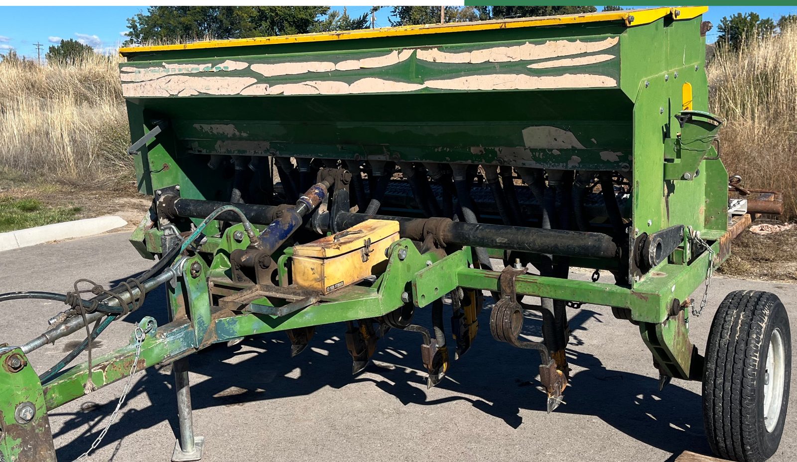 The district's green John Deere no-till drill hitched and ready for pickup