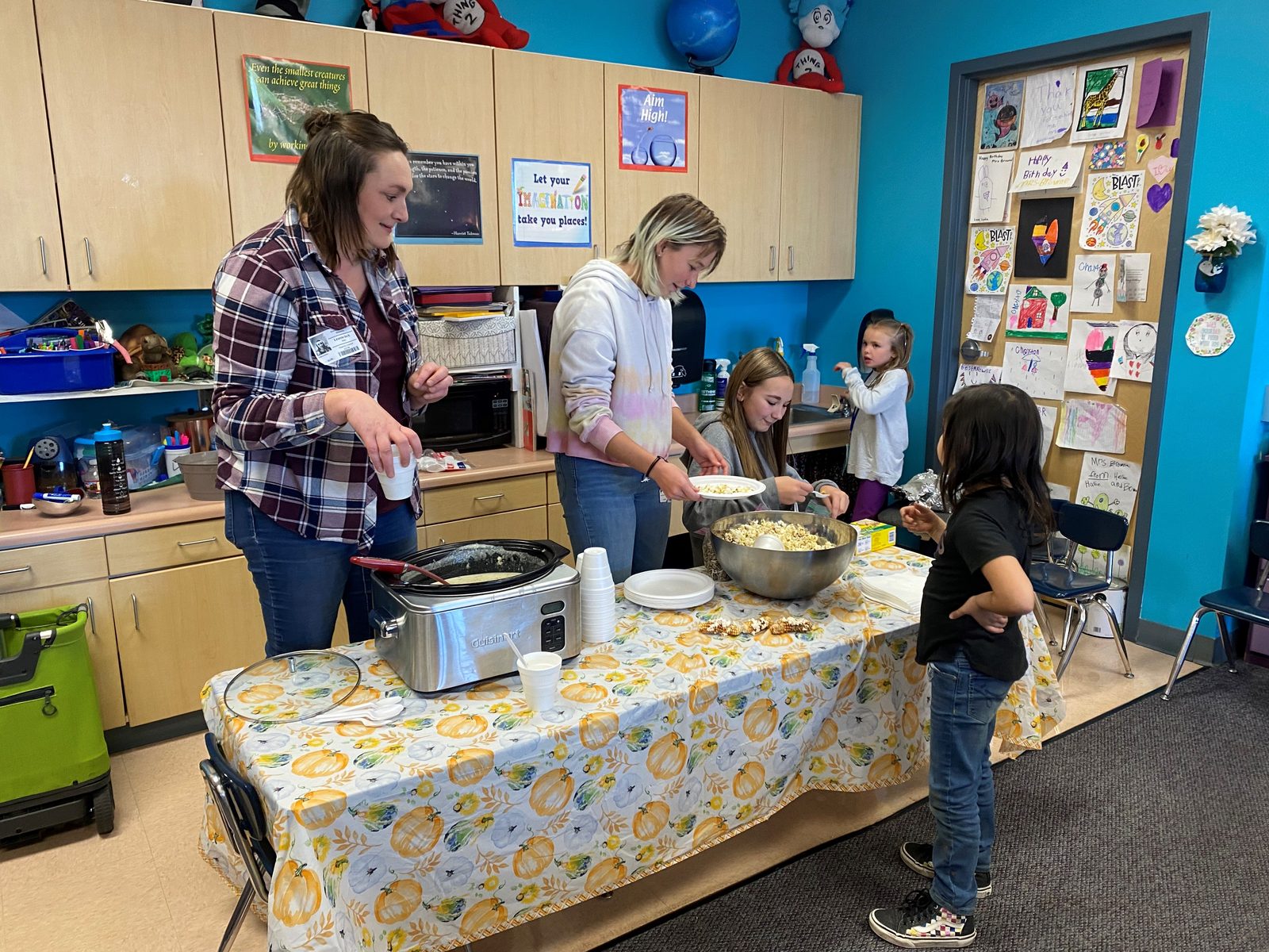 Students celebrating at a school garden harvest party