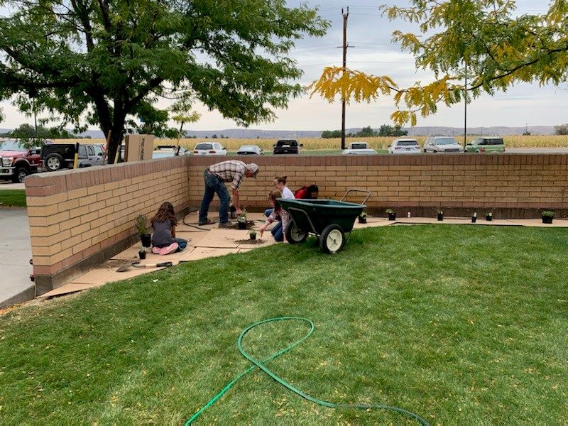 Volunteers installing the pollinator garden beds at Shadow Butte Elementary
