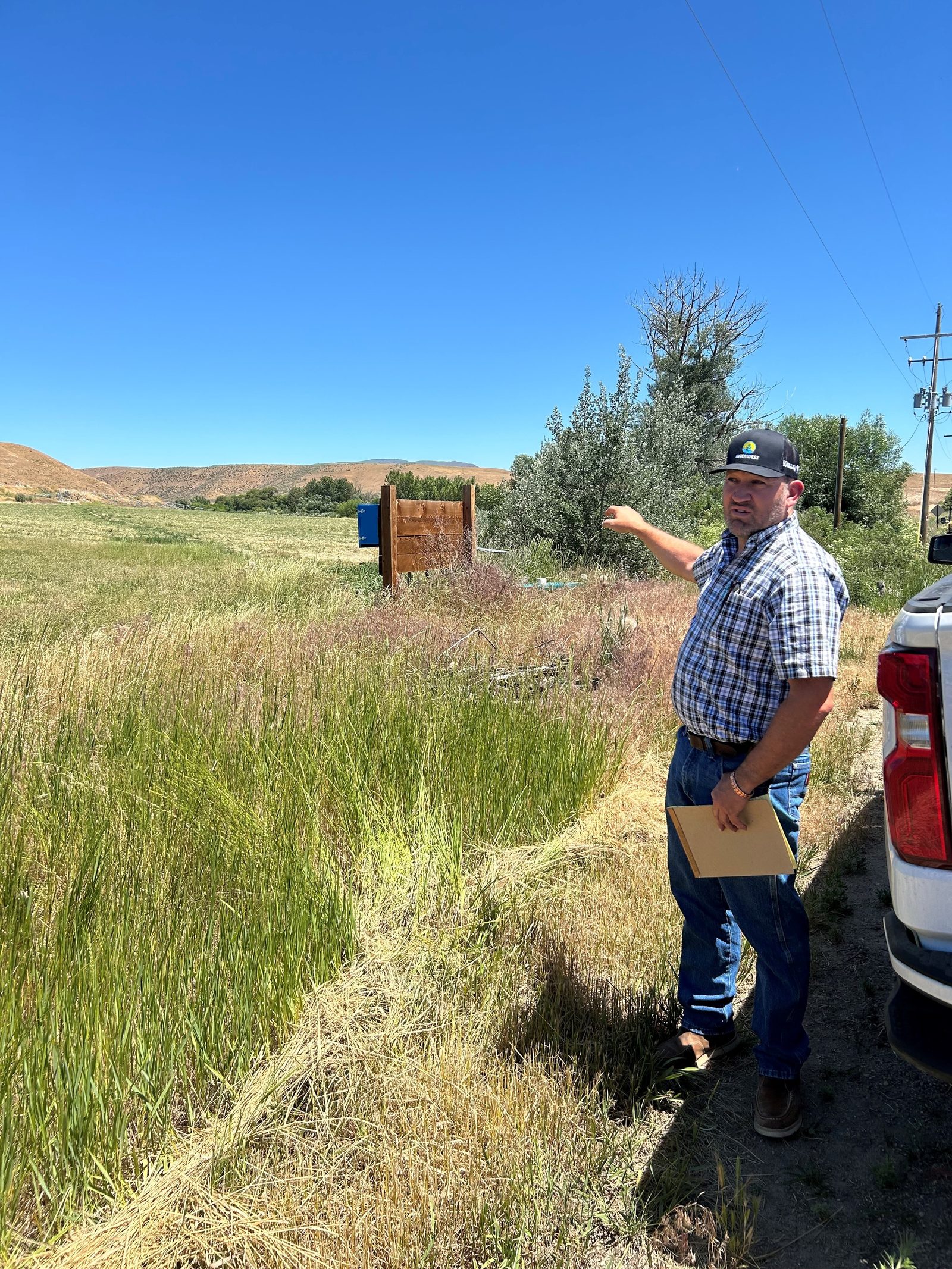 Landowners learning about center-pivot irrigation on a district farm tour