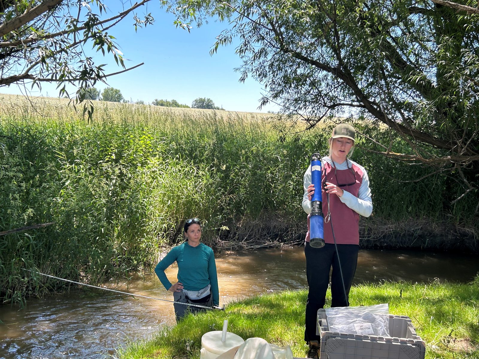 Water sampling demonstration with DEQ on a district tour